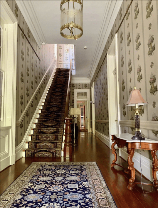 Guests staying on the second floor reach their suites via our fabulous soaring staircase