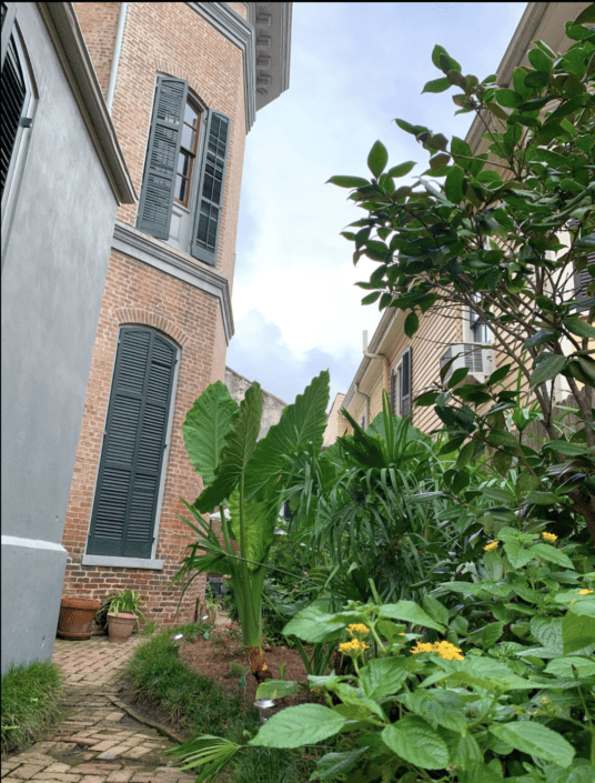 Lush gardens surround the Lanaux Mansion property